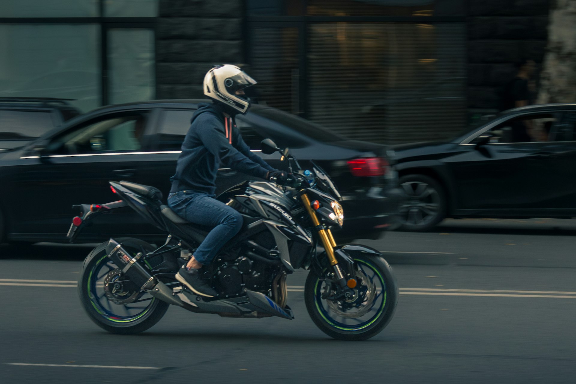 a person riding a motorcycle on a city street